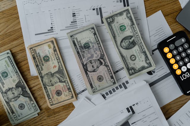 money and calculators and graphs 